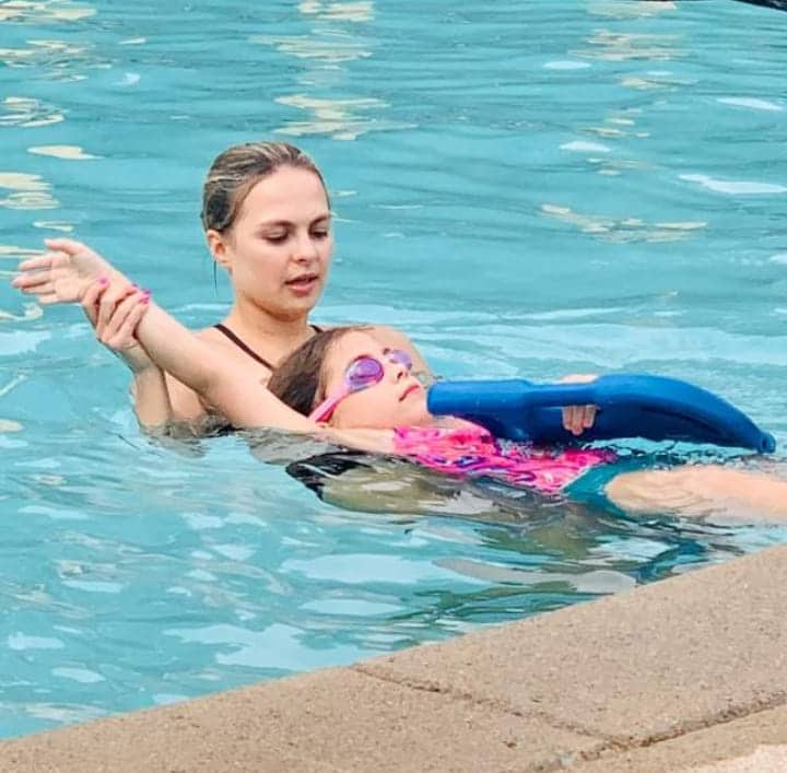 Swim instructor teaching a child during swim lessons in Nashville, TN.